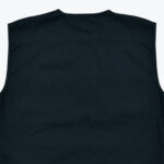 The upper back portion of a dark navy blue sleeveless vest with a horizontal yoke seam, shown against a white background.