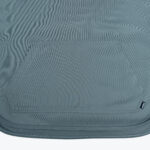 Close-up of a slate blue hoodie front kangaroo pocket with a small black Addos tag on the lower right side.