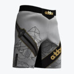 Grey and black MMA grappling shorts featuring a mountain landscape graphic, a stylized sword on the right leg, and a diagonal black stripe with a gold addos logo on the left leg.