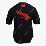 Back view of a black jersey with a large red eagle logo in the center and a small red patch on the collar that reads WE STOP BREACHES