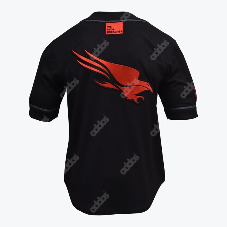 Back view of a black jersey with a large red eagle logo in the center and a small red patch on the collar that reads WE STOP BREACHES