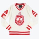 A cream-colored V-neck sweater with red and white striped trim, featuring a large red Delta Sigma Theta crest on the front and red Greek letters on the sleeves.
