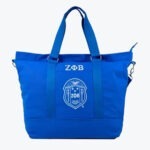 Royal blue tote bag with white Zeta Phi Beta Greek letters and shield emblem on the front.
