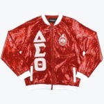 A red sequined bomber jacket with white trim, featuring white Greek letters Delta Sigma Theta on the right and the sorority crest on the left.