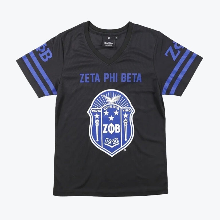 A black v-neck jersey shirt with ZETA PHI BETA printed in blue above the sorority's blue and white crest. The sleeves have blue stripes and Greek letters.