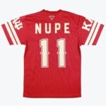 The back view of a red jersey featuring the name NUPE and the number 11 printed in cream. It includes a diamond logo at the top of the back and classic striped details on the sleeves.