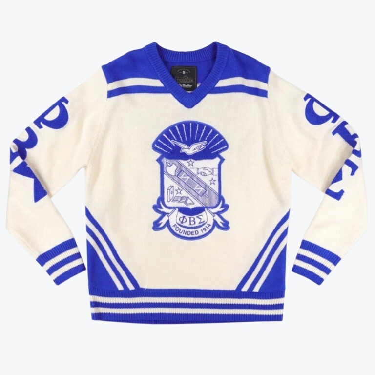 A cream and royal blue knit v-neck sweater featuring the Phi Beta Sigma fraternity crest on the front and Greek letters on the sleeves.
