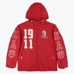 A red hooded windbreaker jacket with Kappa Alpha Psi fraternity branding, featuring on the chest and the Greek letters Kappa, Alpha, Psi on the sleeves.