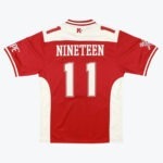 Back view of a red and white jersey with the name NINETEEN and number 11 printed in white.
