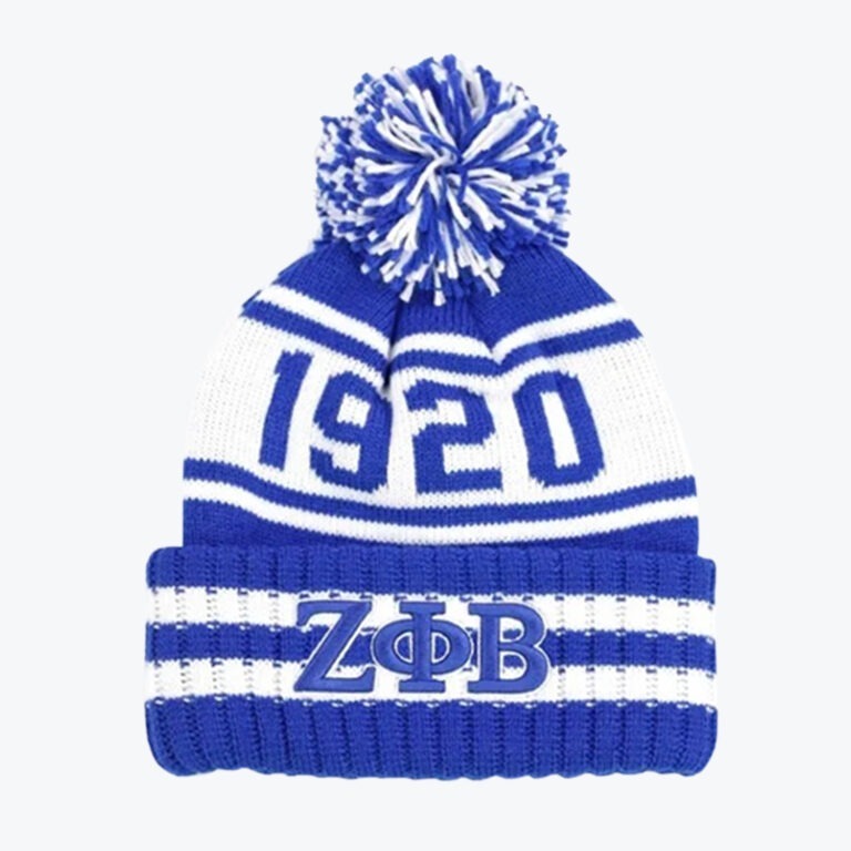 A blue and white knit pom-pom beanie with '1920' knitted on the crown and the Greek letters Zeta Phi Beta embroidered on the cuff.