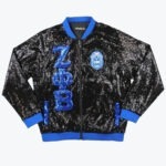Black sequined bomber jacket with blue trim, featuring large blue sequin Zeta Phi Beta Greek letters on one side and the sorority shield on the other.