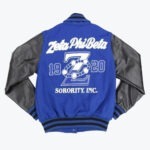 Back view of a royal blue and black varsity jacket featuring Zeta Phi Beta Sorority, Inc. embroidery, including the founding year 1920 and a large letter Z wrapped in pearls.