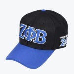 A black and blue baseball cap with embroidered Greek letters Zeta Phi Beta on the front and NINETEEN 20 on the side.
